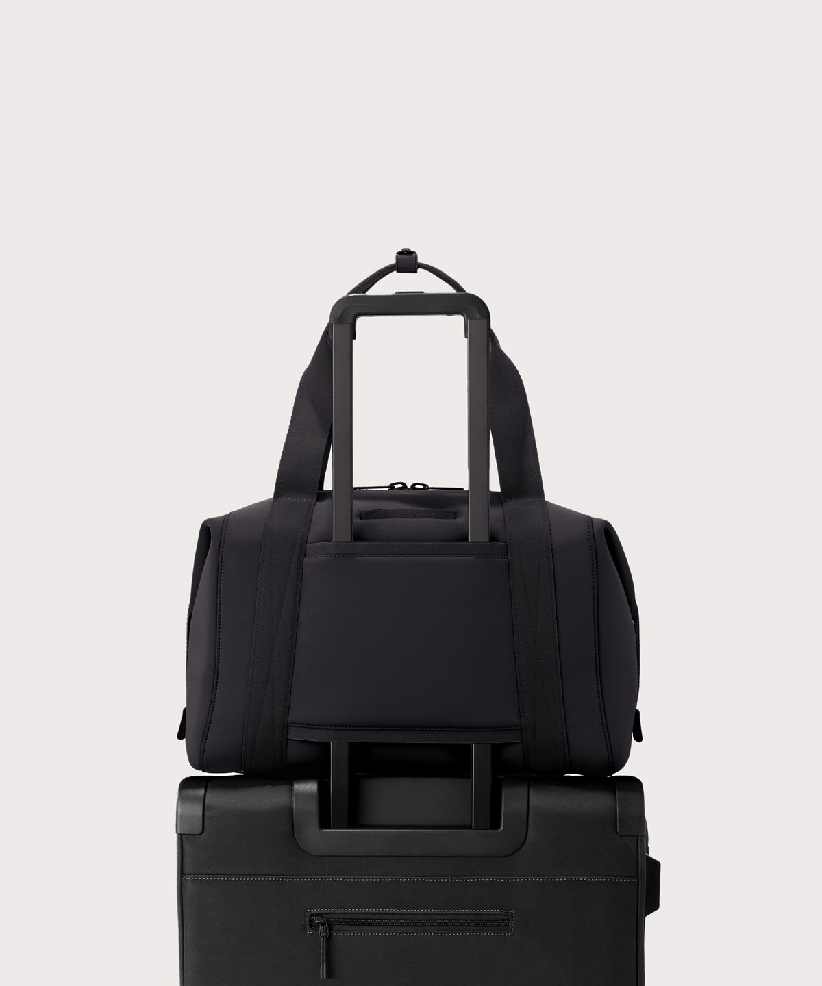 Large Landon Carryall in black displaying luggage sleeve