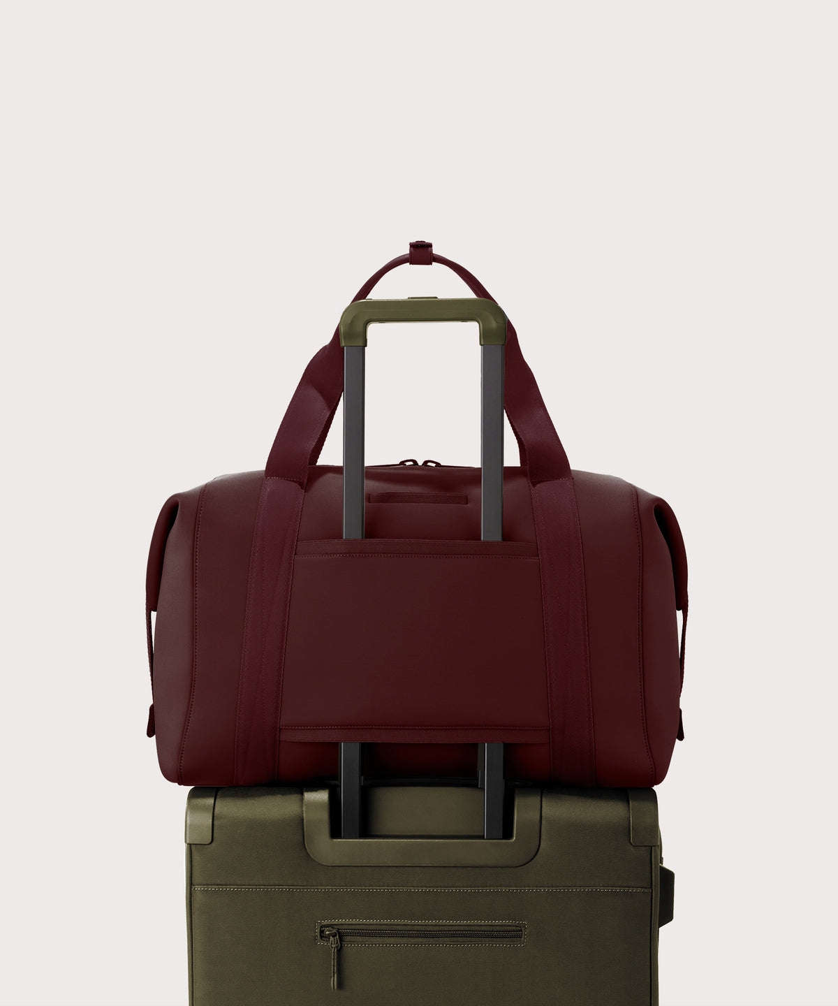 Dagne Dover Extra Large Landon Carryall in a deep brown with purple undertones displaying luggage sleeve.
