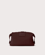 Dagne Dover Large Hunter Toiletry Bag in a deep brown with purple undertones.