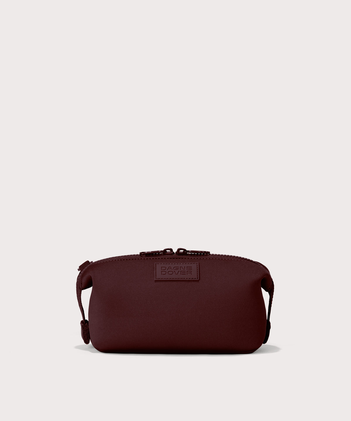 Dagne Dover Small Hunter Toiletry Bag in a deep brown with purple undertones.