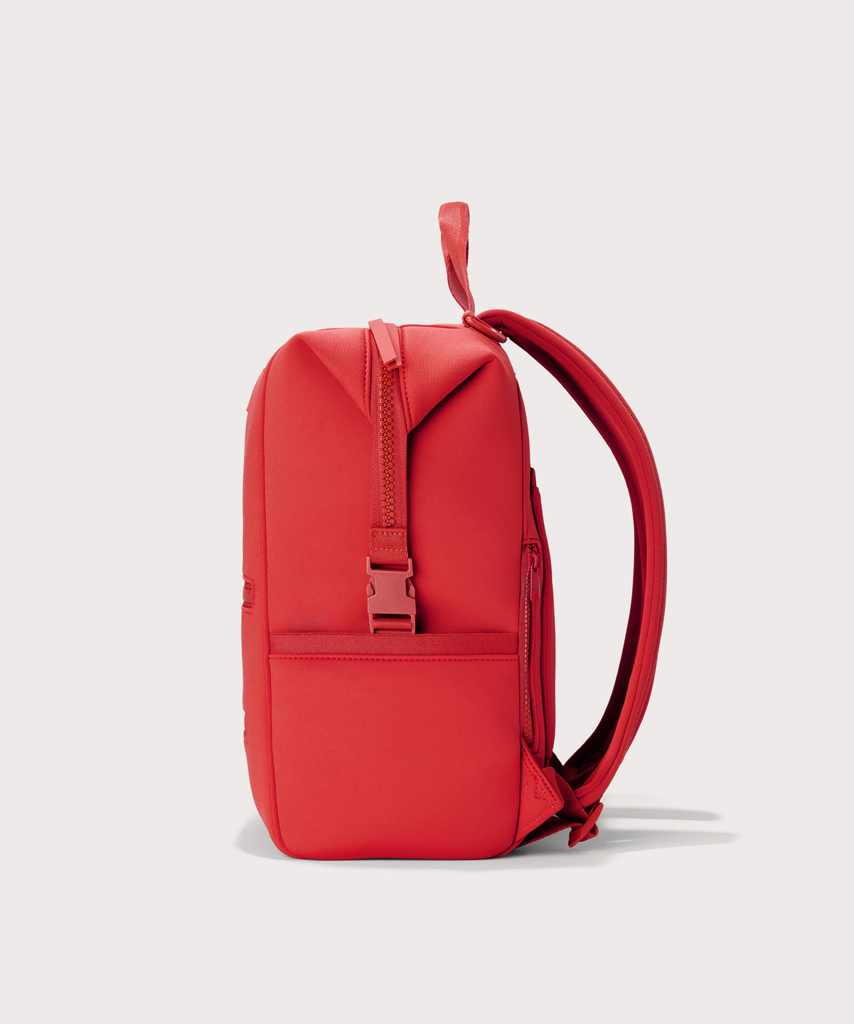 Dagne Dover Large Indi Diaper Backpack in a fiery, saturated red leaning toward orange seen from the side.