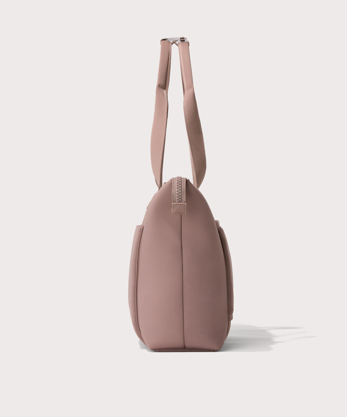 Tote in a pink seen from the side view.