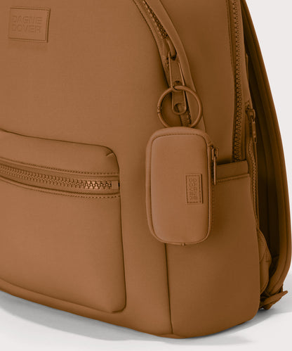 Mara Keychain in a saturated, warm medium-brown with burnt orange undertones. front angle showing keychain on a dakota backpack.
