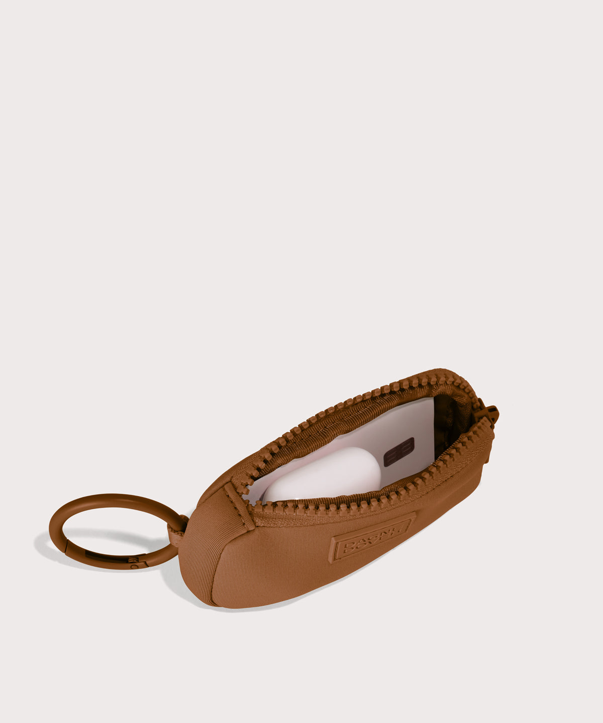 Mara Keychain in a saturated, warm medium-brown with burnt orange undertones . unzipped, top down view.