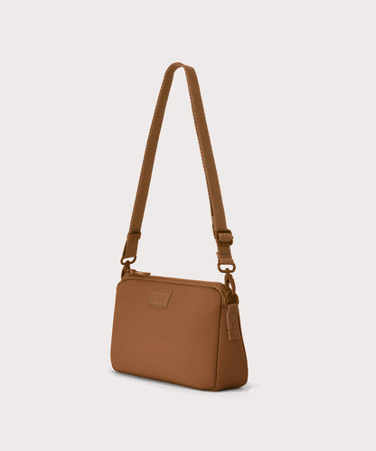 Nora shoulder bag in a saturated, warm medium-brown with burnt orange undertones, side angle view