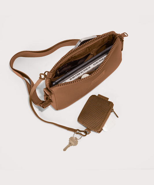 Nora shoulder bag in a saturated, warm medium-brown with burnt orange undertones unzipped, top down view.