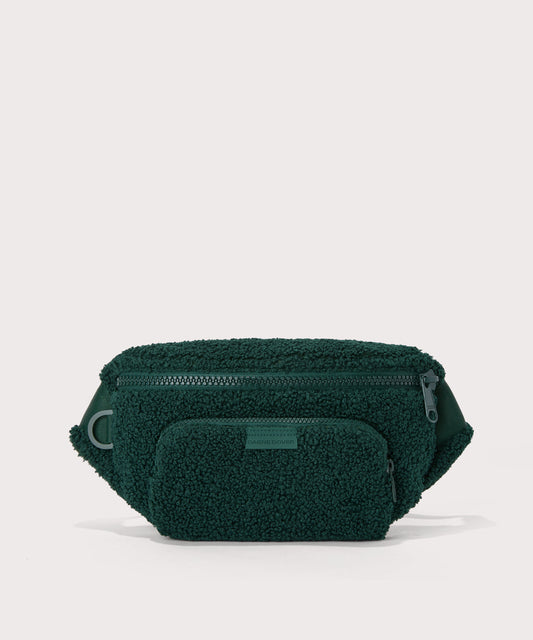 Jax fanny pack in a saturated, jewel-toned deep green with bold blue undertones. In a Faux Shearling a soft, wool-like plush made with recycled materials