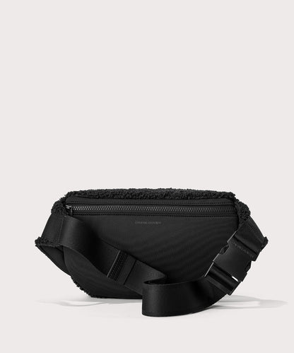 Jax fanny pack in a black. Back view. In a Faux Shearling a soft, wool-like plush made with recycled materials