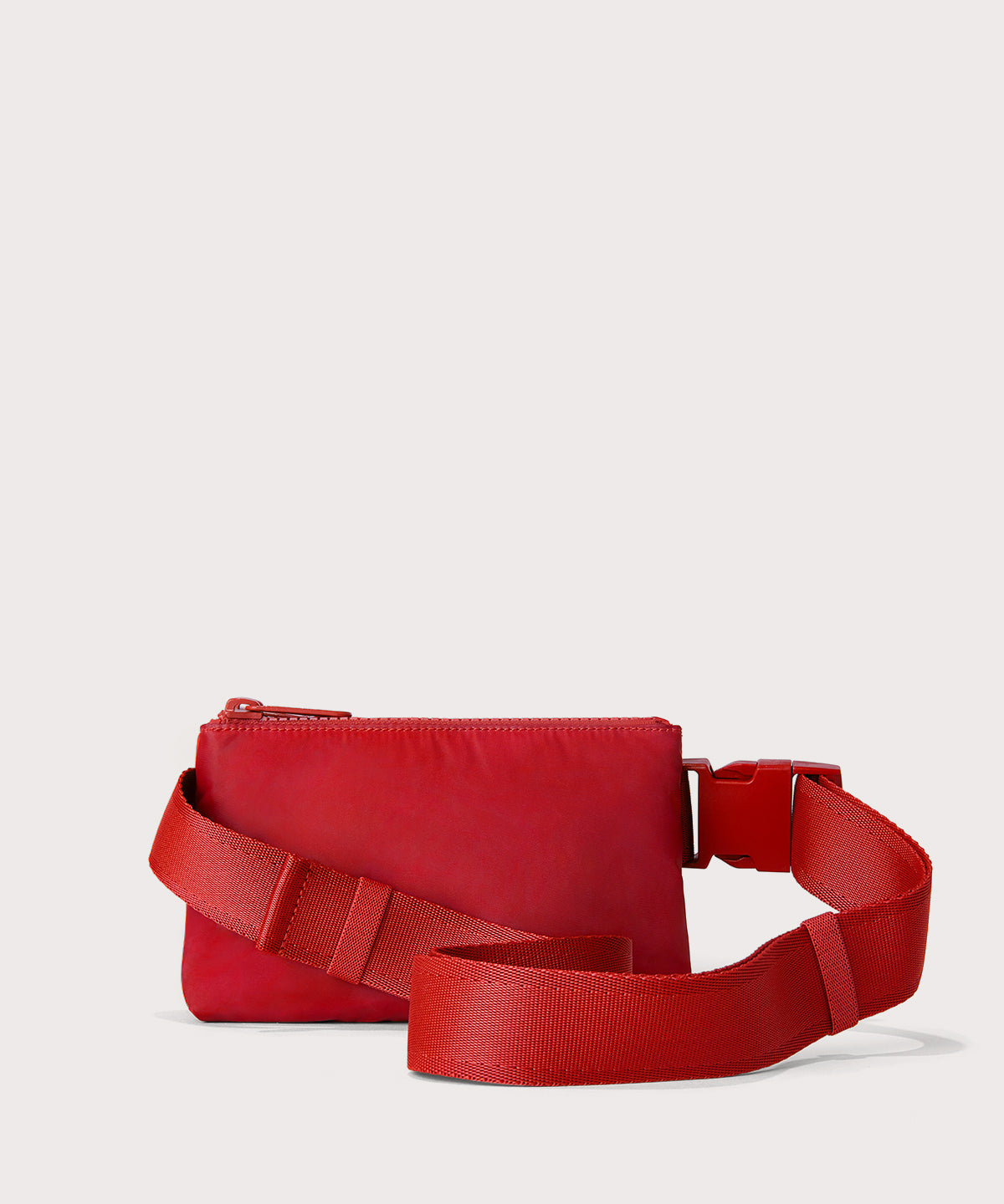 Dagne Dover Bennie Sling in a fiery, saturated red leaning toward orange seen from the back.