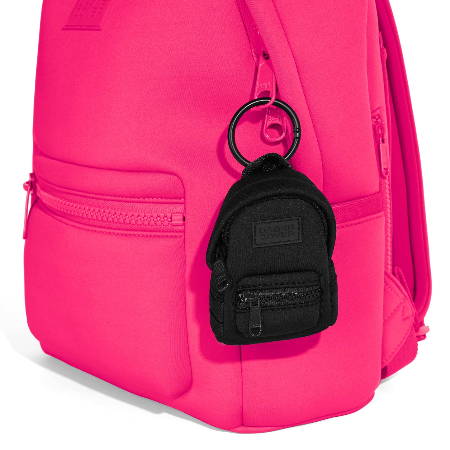 Dagne Dover Dakota Keychain in black clipped onto a backpack. hover