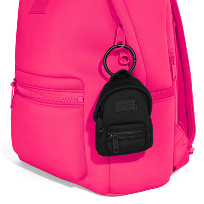 Dagne Dover Dakota Keychain in black clipped onto a backpack. hover