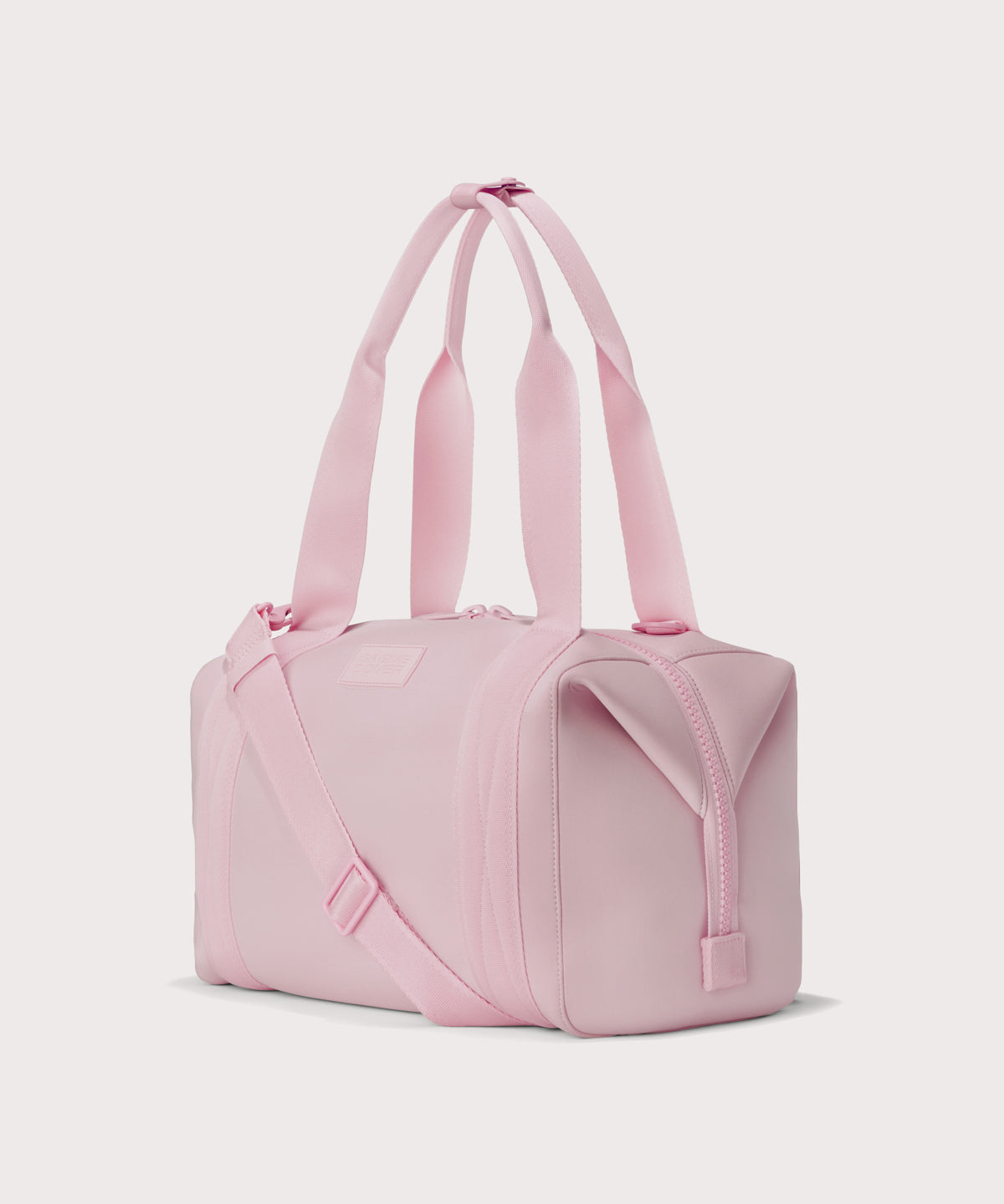 Medium Landon Carryall in a cool, powdery pink with soft grey undertones, side angle view