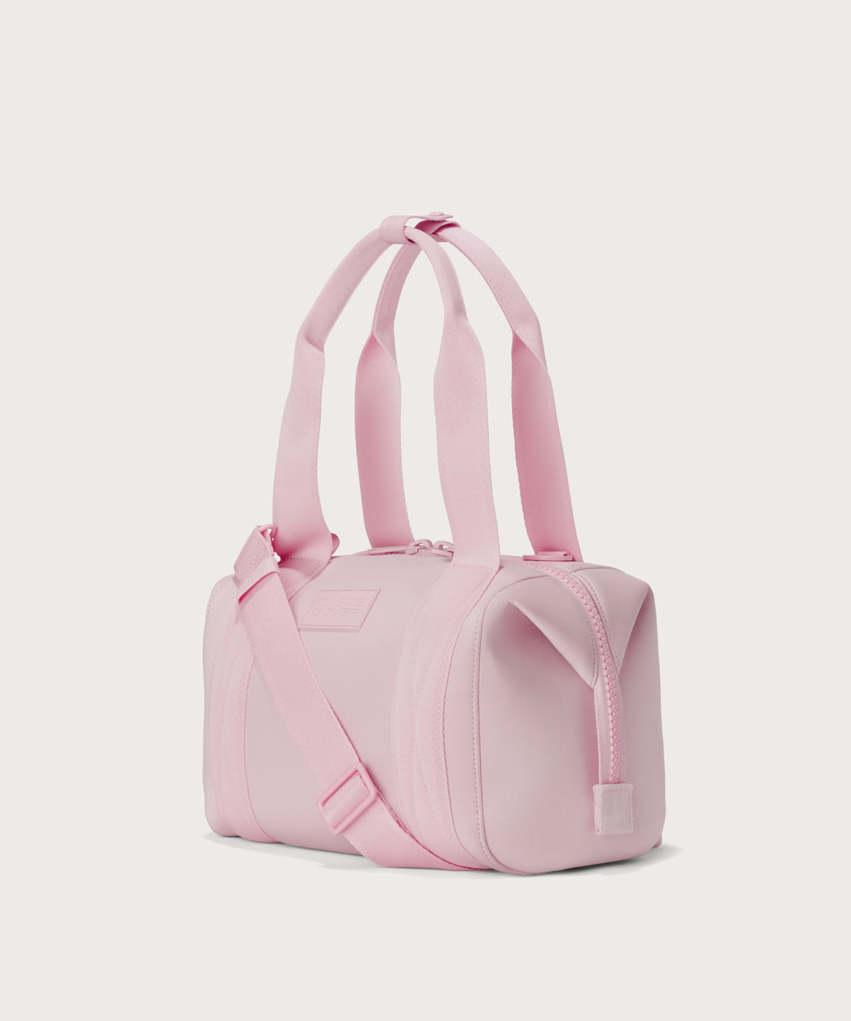Small Landon Carryall in a cool, powdery pink with soft grey undertones, side angle view