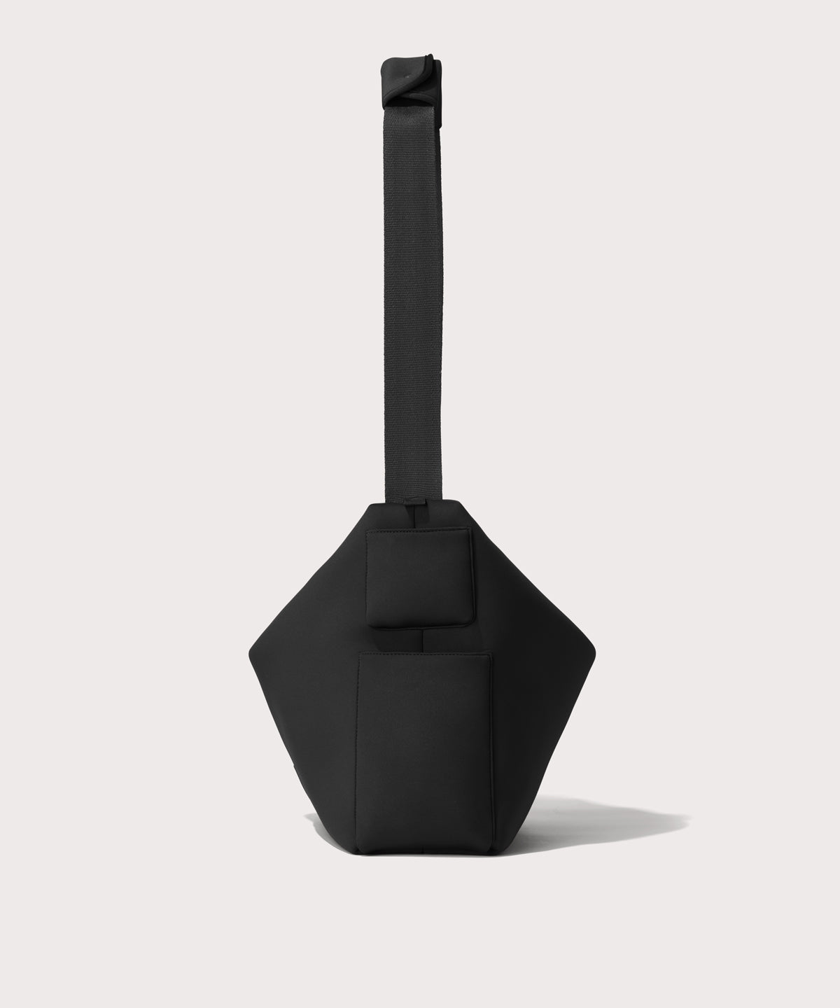 Large Shoulder bag in a black seen from the side view showing phone pocket.