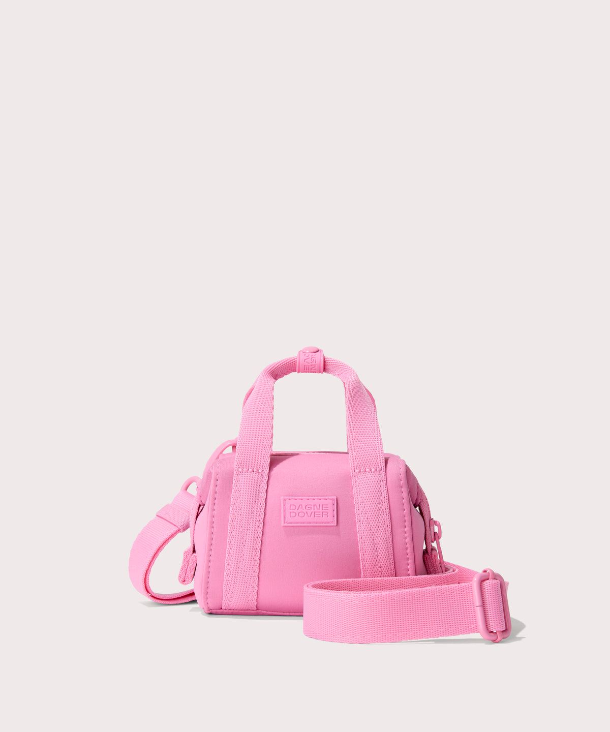 Dagne Dover Micro Landon Crossbody in a true bubble gum pink.