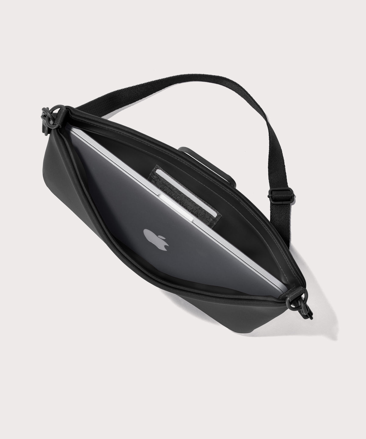 14 inch laptop shoulder bag in a black seen from the top down view showing interior.