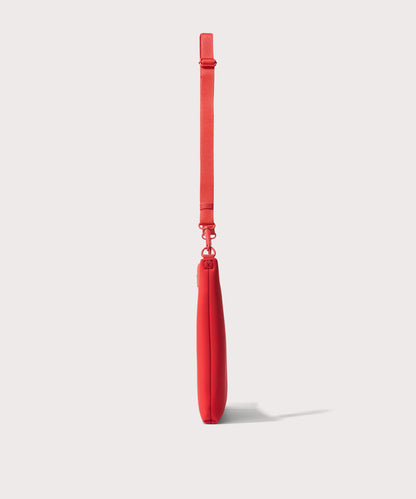 16 inch laptop shoulder bag in a fiery, saturated red leaning toward orange seen from the side view.
