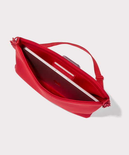 16 inch laptop shoulder bag in a fiery, saturated red leaning toward orange seen from the top down view showing interior.