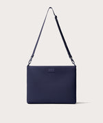 16 inch laptop shoulder bag in navy blue seen from the front view.