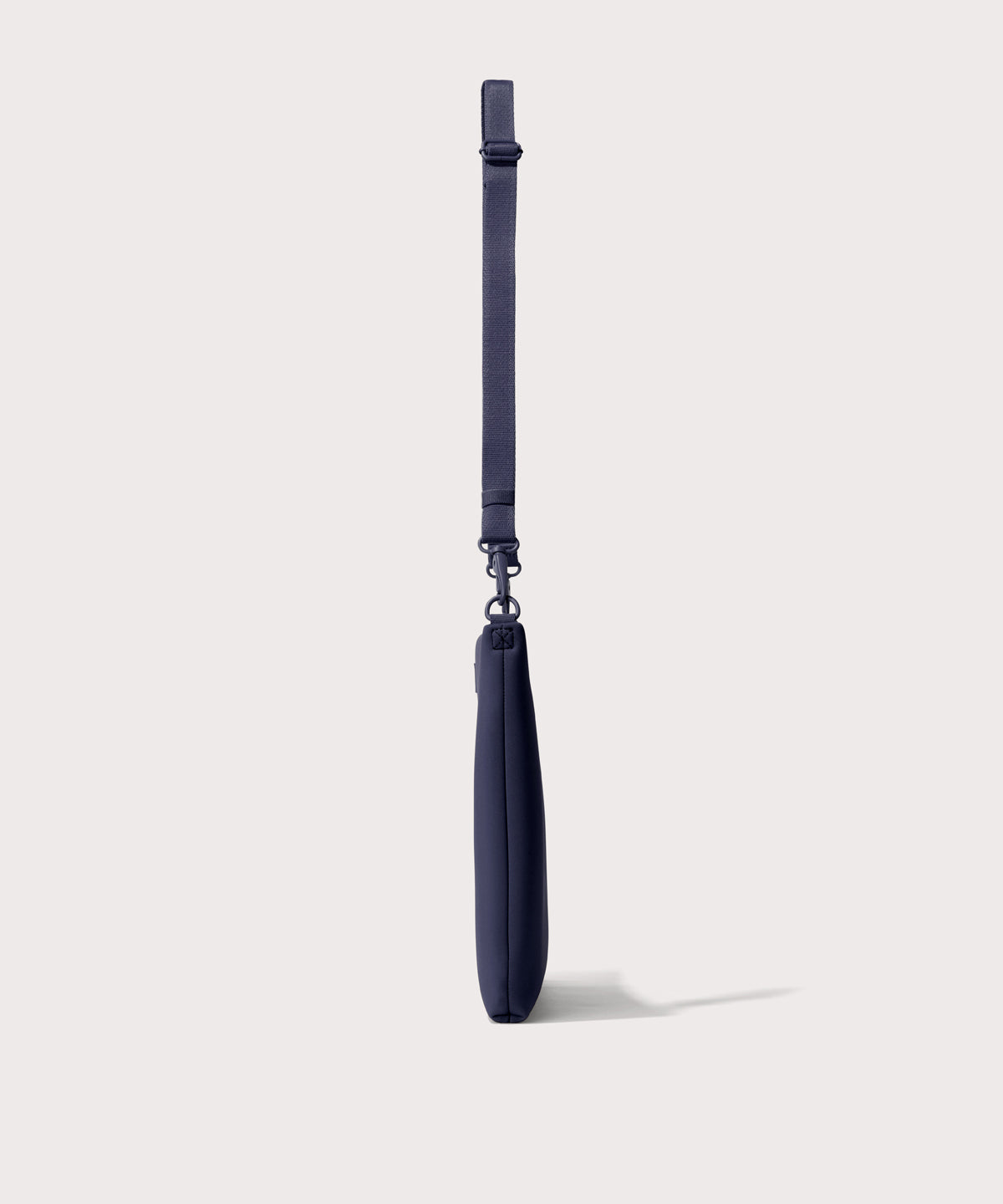 16 inch laptop shoulder bag in navy blue seen from the side view.