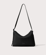 Shoulder bag in a black seen from the front view.