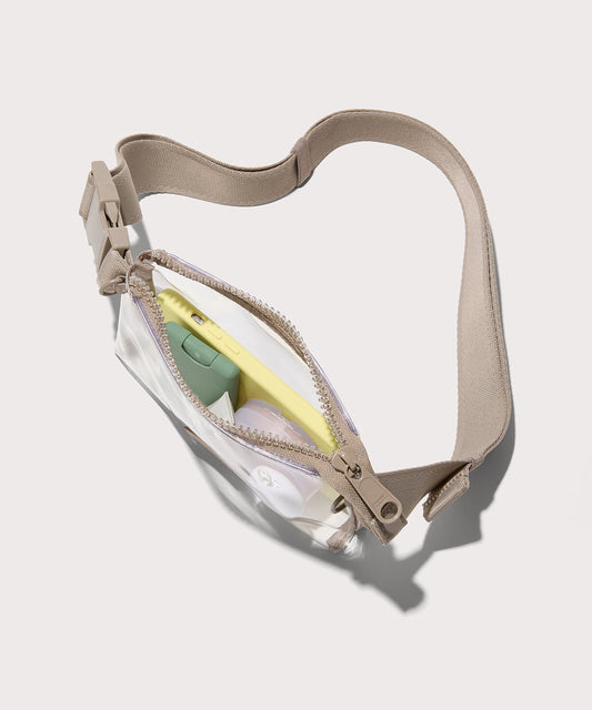 Clear crossbody bag with a beige strap on a white background. Stadium compliant.