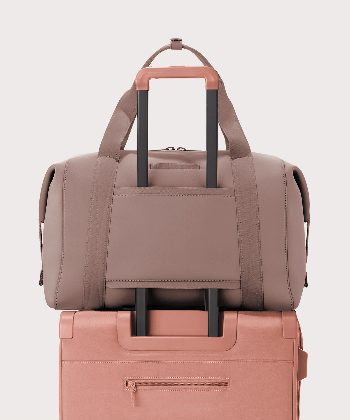 Extra large Landon Carryall in pink displaying luggage sleeve