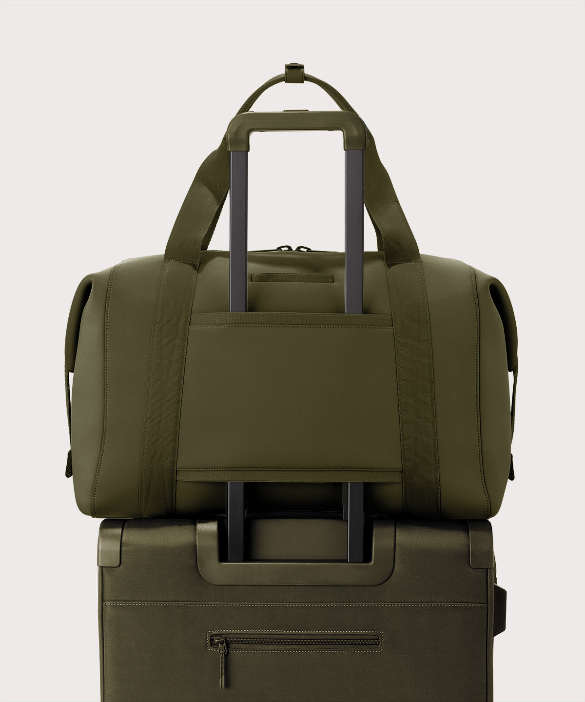 Extra large Landon Carryall in dark green displaying luggage sleeve