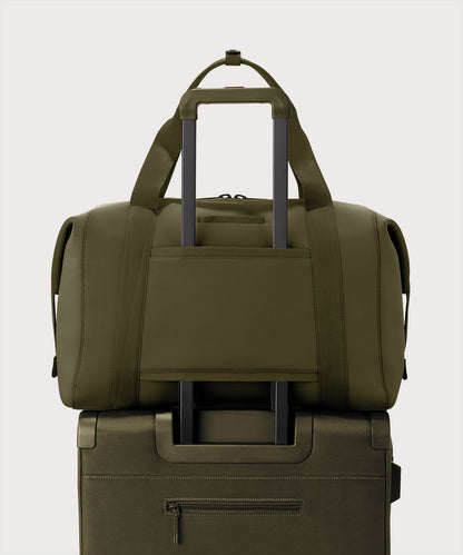 Extra large Landon Carryall in dark green displaying luggage sleeve