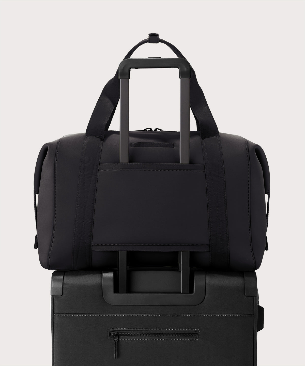 Extra large Landon Carryall in dark green displaying luggage sleeve