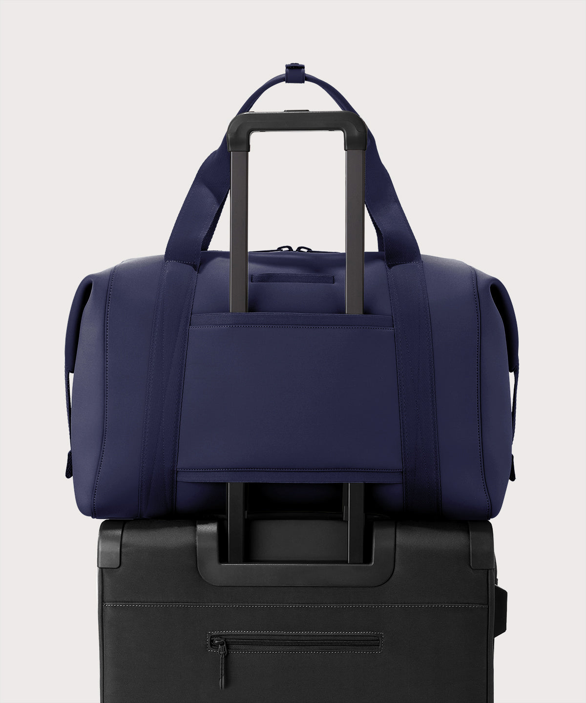 Extra large Landon Carryall in storm displaying luggage sleeve