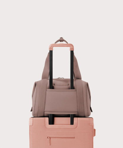 Large Landon Carryall in pink displaying luggage sleeve
