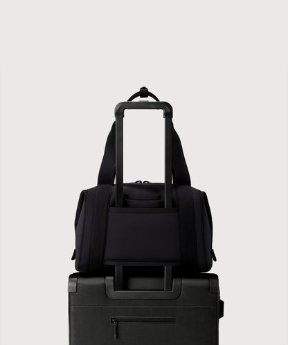 Large Landon Carryall in black displaying luggage sleeve