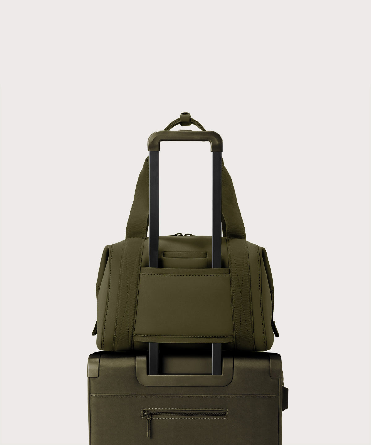 Large Landon Carryall in dark green displaying luggage sleeve