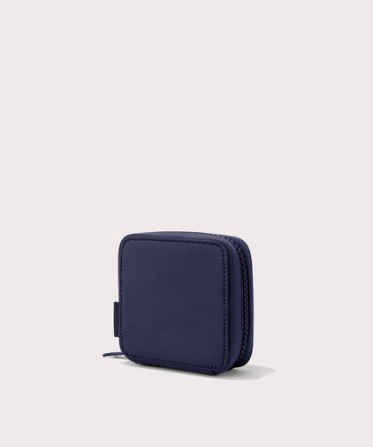 Dagne Dover small Arlo Tech Organizer in dark blue seen from an angle.