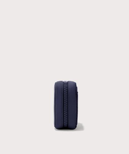 Dagne Dover small Arlo Tech Organizer in dark blue seen from the side.