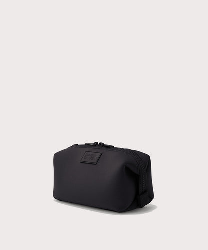 Dagne Dover Small Hunter Toiletry Bag in black seen from an angle.
