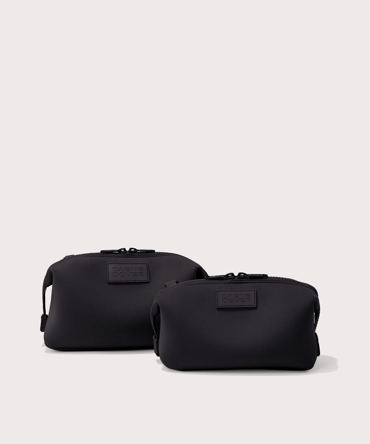 Dagne Dover Small and Large Hunter Toiletry Bags in black.