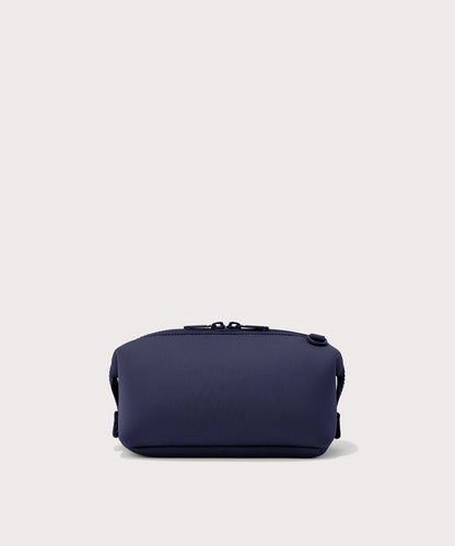 Dagne Dover Small Hunter Toiletry Bag in dark blue seen from the back.