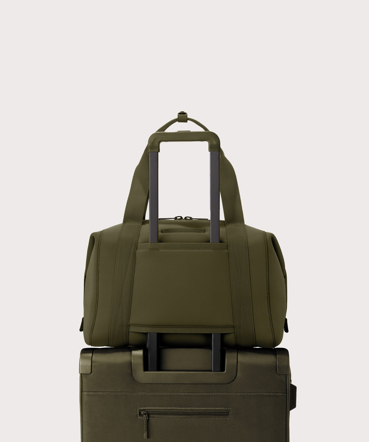 Large Landon Carryall in dark green displaying luggage sleeve