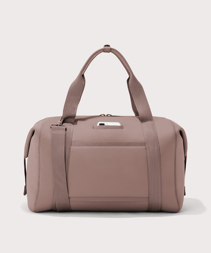 Extra large Landon Carryall in pink, displaying an exterior phone pocket