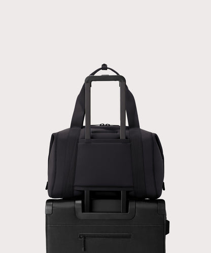 Large Landon Carryall in black displaying luggage sleeve