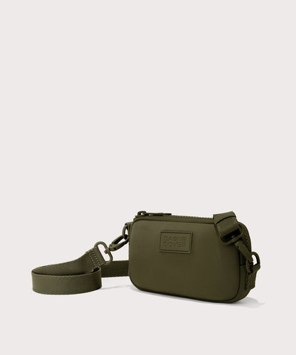 Dagne Dover Mara Phone Sling in dark green seen from an angle, showing the adjustable shoulder strap drop.