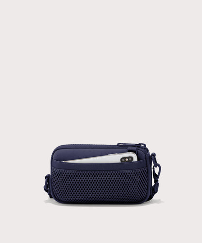 Dagne Dover Mara Phone Sling in dark blue showing the exterior air mesh slip.