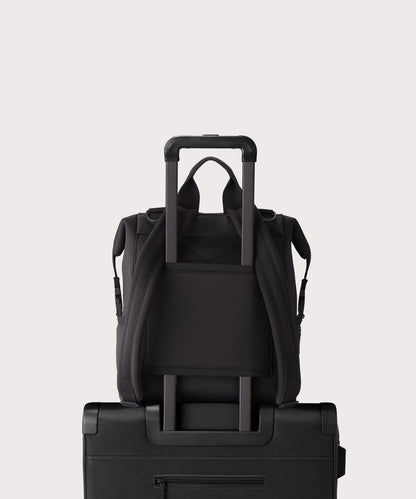 Dagne Dover medium Indi Diaper Backpack in black showing the neoprene luggage sleeve.