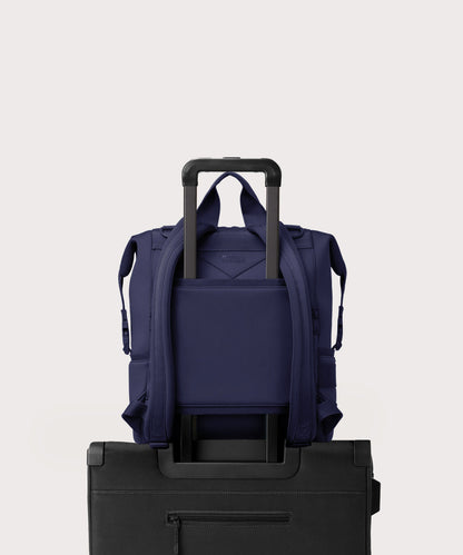 Dagne Dover Large Indi Diaper Backpack in dark blue showing the neoprene luggage sleeve.