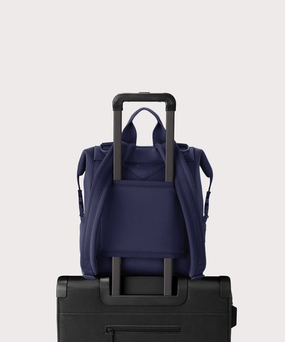 Dagne Dover medium Indi Diaper Backpack in dark blue showing the neoprene luggage sleeve.
