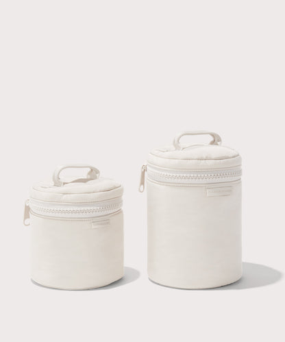 Dagne Dover small and large Mila Toiletry Pouches in white.