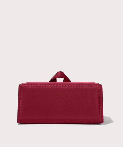 Dagne Dover Remi foldable glasses holder in spice red seen from the back.