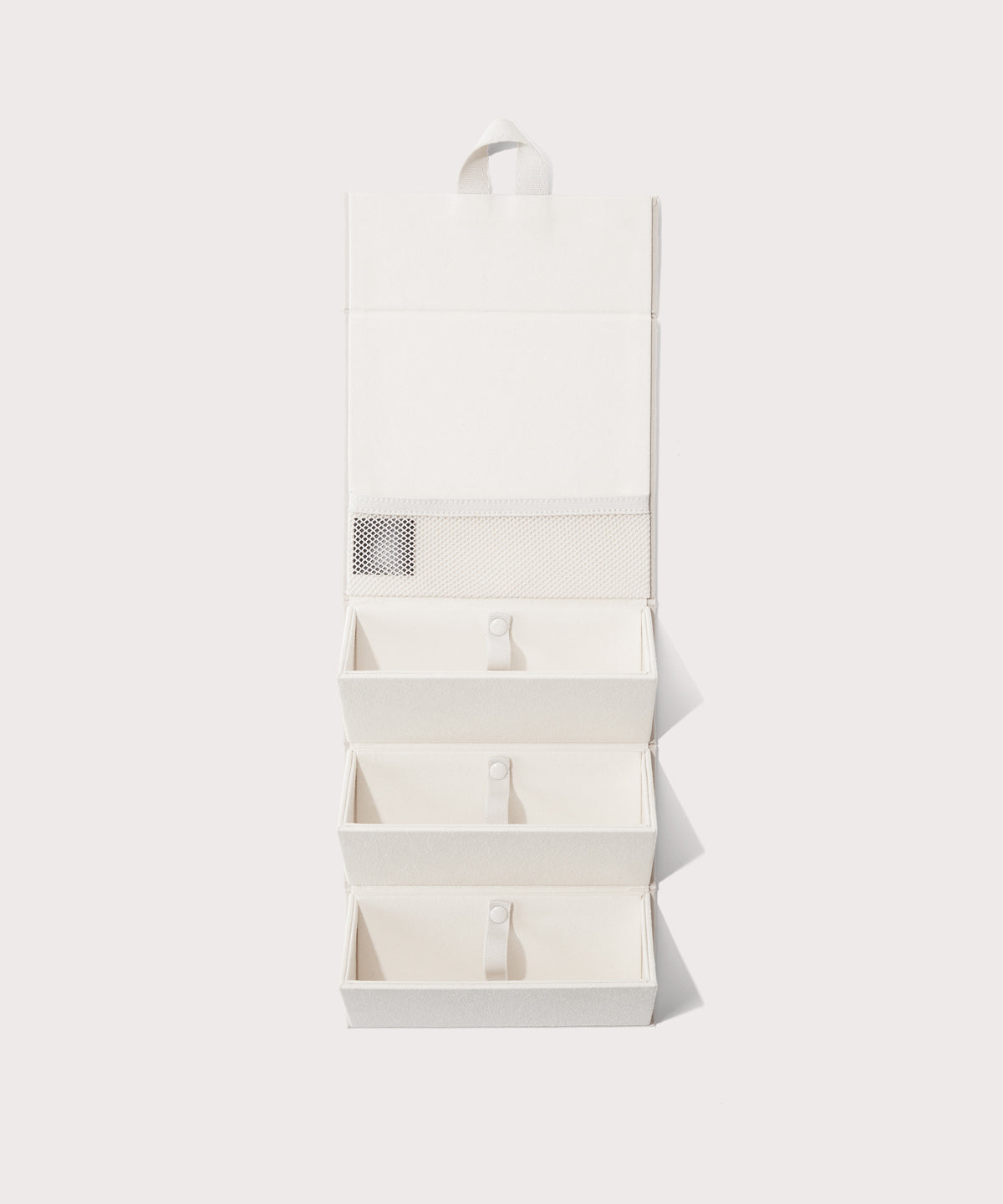 Dagne Dover Remi foldable glasses holder in white hung up.
